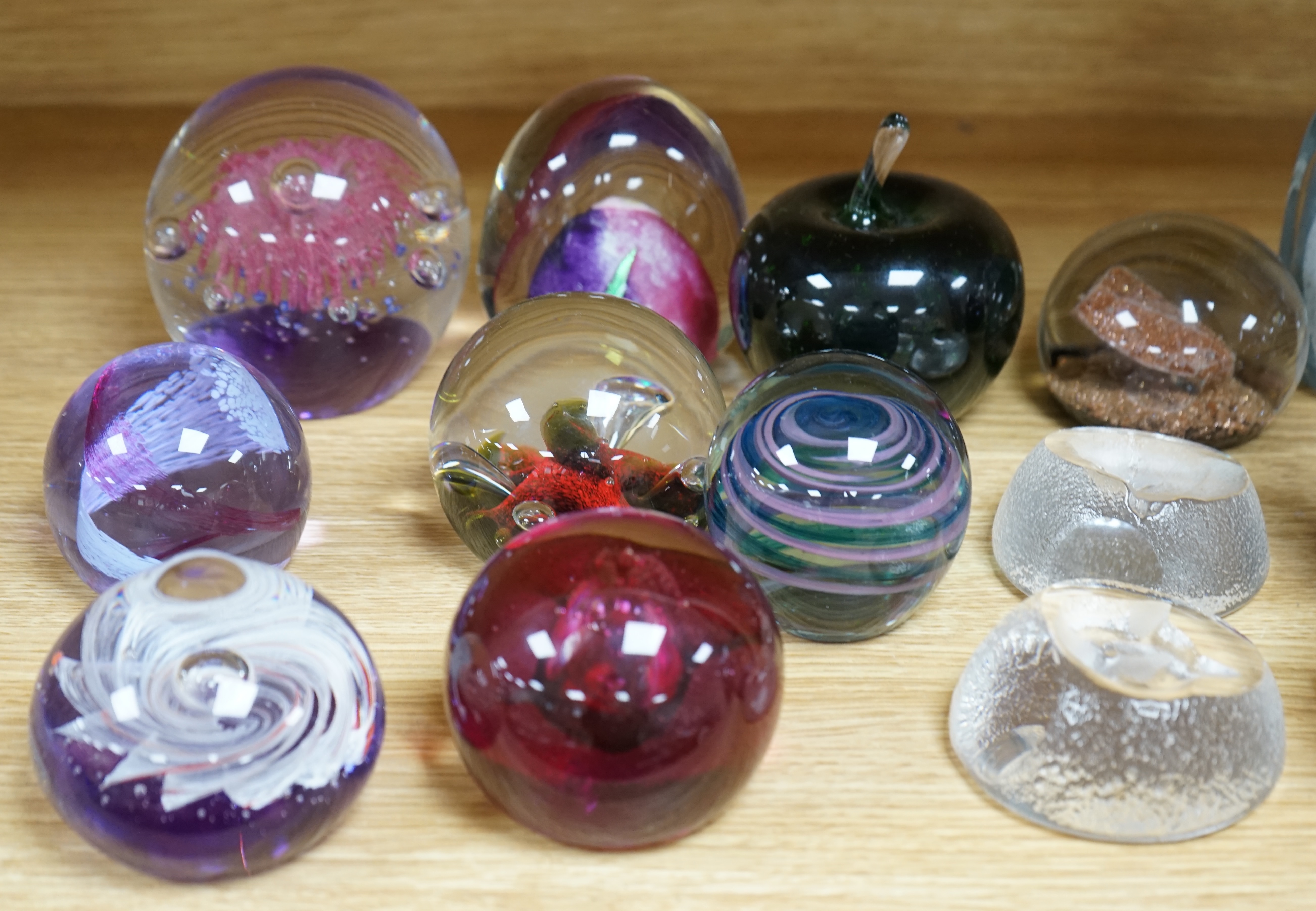 Twenty three glass paperweights, including five with silhouettes of animals, and others of unusual shape. Condition - good